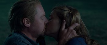 Movie still from “Paul” (2011), directed by Greg Mottola – A man and a woman kissing each other; Close Up shot, Low angle