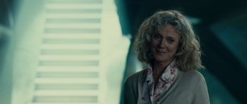 Movie still from “Paul” (2011), directed by Greg Mottola – A person wearing a suit and tie; Close Up shot, Over the shoulder angle