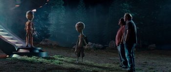 Movie still from “Paul” (2011), directed by Greg Mottola – An image of an extraterrestrial in a field at night; Wide shot, Over the shoulder angle