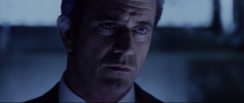 Movie still from “Payback” (1999), directed by Brian Helgeland – A man that is looking at the camera; Close Up shot, Low angle