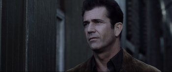 Movie still from “Payback” (1999), directed by Brian Helgeland – A person wearing a suit and tie; Close Up shot, Low angle