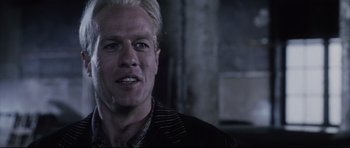 Movie still from “Payback” (1999), directed by Brian Helgeland – A person wearing a suit and tie; Close Up shot, Low angle