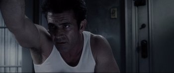 Movie still from “Payback” (1999), directed by Brian Helgeland – A person wearing a tank top; Close Up shot, Low angle