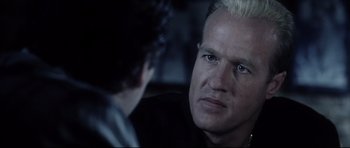 Movie still from “Payback” (1999), directed by Brian Helgeland – A person looking at another person; Close Up shot, Over the shoulder angle