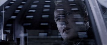 Movie still from “Payback” (1999), directed by Brian Helgeland – A man looking out of a car window at night; Close Up shot, Low angle