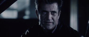 Movie still from “Payback” (1999), directed by Brian Helgeland – A person wearing a jacket; Close Up shot, Over the shoulder angle