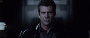 Movie still from “Payback” (1999), directed by Brian Helgeland – A person wearing a leather jacket; Close Up shot, Low angle