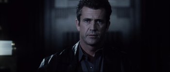 Movie still from “Payback” (1999), directed by Brian Helgeland – A person wearing a leather jacket; Close Up shot, Low angle