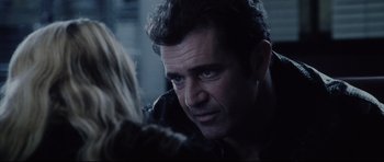 Movie still from “Payback” (1999), directed by Brian Helgeland – A person looking at another person; Close Up shot, Over the shoulder angle