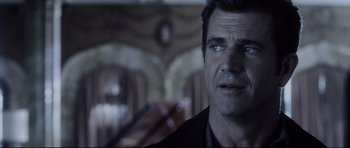 Movie still from “Payback” (1999), directed by Brian Helgeland – A person wearing a suit and tie; Close Up shot, Over the shoulder angle