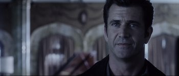 Movie still from “Payback” (1999), directed by Brian Helgeland – A person wearing a black shirt; Close Up shot, Over the shoulder angle