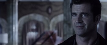 Movie still from “Payback” (1999), directed by Brian Helgeland – A person wearing a suit and tie; Close Up shot, Over the shoulder angle