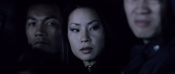 Movie still from “Payback” (1999), directed by Brian Helgeland – A person wearing a suit and tie; Close Up shot, Over the shoulder angle