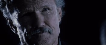 Movie still from “Payback” (1999), directed by Brian Helgeland – An old man with a mustache and a beard; Close Up shot, Low angle