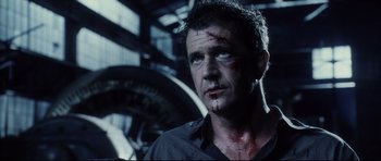 Movie still from “Payback” (1999), directed by Brian Helgeland – A person with blood on his face; Close Up shot, Over the shoulder angle