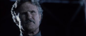 Movie still from “Payback” (1999), directed by Brian Helgeland – An older man with a mustache and a mustache comb; Close Up shot, Low angle
