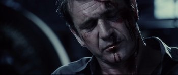 Movie still from “Payback” (1999), directed by Brian Helgeland – A person with blood all over his face; Close Up shot, Low angle
