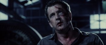 Movie still from “Payback” (1999), directed by Brian Helgeland – A person with blood on his face; Close Up shot, Low angle