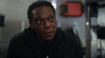 Movie still from “Peacemaker” (2022), created by James Gunn – A person looking at the camera; Close Up shot, Over the shoulder angle