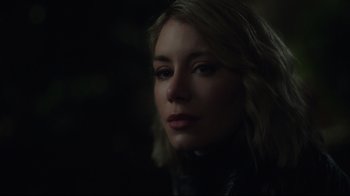 Movie still from “Peacemaker” (2022), created by James Gunn – A person wearing a black jacket; Close Up shot, Over the shoulder angle