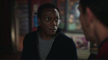 Movie still from “Peacemaker” (2022), created by James Gunn – A person looking at the camera; Close Up shot, Over the shoulder angle