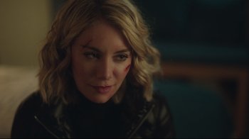 Movie still from “Peacemaker” (2022), created by James Gunn – A person wearing a leather jacket; Close Up shot, Over the shoulder angle