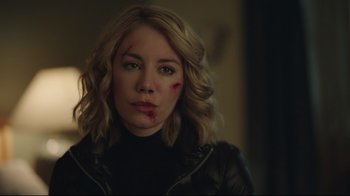 Movie still from “Peacemaker” (2022), created by James Gunn – A person wearing a leather jacket; Close Up shot, Over the shoulder angle