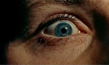 Movie still from “Peeping Tom” (1960), directed by Michael Powell – A person's blue eye; Extreme Close Up shot, Overhead angle