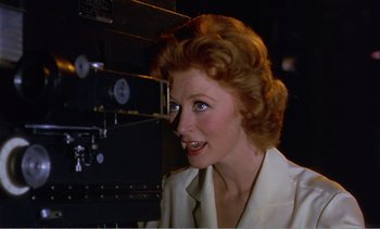 Movie still from “Peeping Tom” (1960), directed by Michael Powell – A person wearing a white shirt; Close Up shot, Low angle