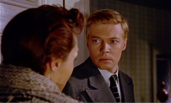 Movie still from “Peeping Tom” (1960), directed by Michael Powell – A man looking at a woman in the mirror; Close Up shot, Over the shoulder angle