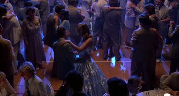 Movie still from “Peggy Sue Got Married” (1986), directed by Francis Ford Coppola – A group of young people dancing in a room; Wide shot, High angle