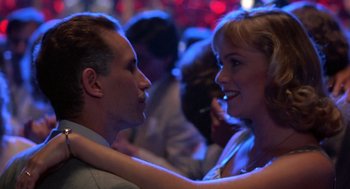 Movie still from “Peggy Sue Got Married” (1986), directed by Francis Ford Coppola – A man and a woman are dancing in a club; Close Up shot, Low angle