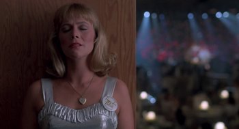 Movie still from “Peggy Sue Got Married” (1986), directed by Francis Ford Coppola – A woman in a silver dress with her eyes closed; Close Up shot, Low angle