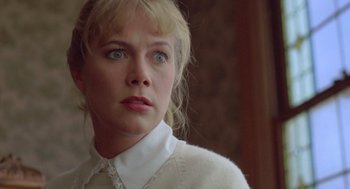 Movie still from “Peggy Sue Got Married” (1986), directed by Francis Ford Coppola – A person wearing a white shirt; Close Up shot, Low angle