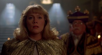 Movie still from “Peggy Sue Got Married” (1986), directed by Francis Ford Coppola – A person wearing a suit and tie; Close Up shot, Low angle