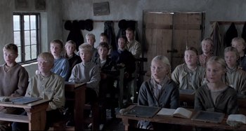 Movie still from “Pelle the Conqueror” (1987), directed by Bille August – A group of children sitting at a desk in a classroom; Medium shot, High angle