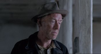 Movie still from “Pelle the Conqueror” (1987), directed by Bille August – A person wearing a hat; Close Up shot, Low angle