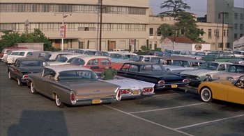 Movie still from “Pepe” (1960), directed by George Sidney – A parking lot filled with lots of parked cars; Extreme Wide shot, High angle
