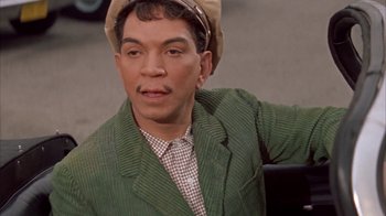 Movie still from “Pepe” (1960), directed by George Sidney – A man wearing a green jacket and a hat; Close Up shot, Low angle