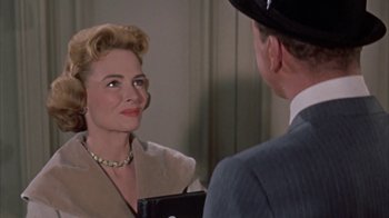 Movie still from “Pepe” (1960), directed by George Sidney – A man and a woman are looking at one another in the mirror; Close Up shot, Over the shoulder angle