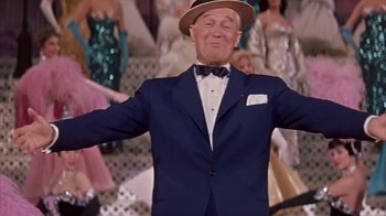 Movie still from “Pepe” (1960), directed by George Sidney – An older man wearing a suit and a bow tie; Medium shot, Low angle