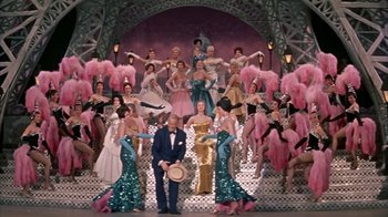 Movie still from “Pepe” (1960), directed by George Sidney – A group of people standing in front of a stage; Wide shot, High angle