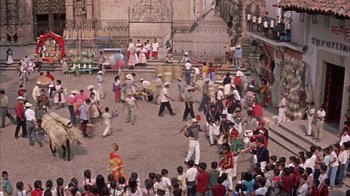 Movie still from “Pepe” (1960), directed by George Sidney – A group of people are gathered in a courtyard; Extreme Wide shot, High angle