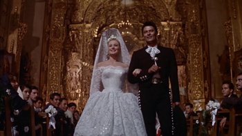 Movie still from “Pepe” (1960), directed by George Sidney – A man and a woman in a wedding dress; Wide shot, Low angle