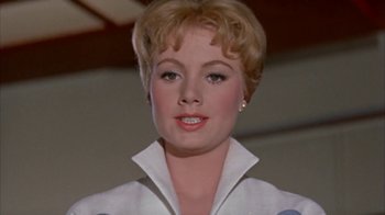 Movie still from “Pepe” (1960), directed by George Sidney – A person with short blonde hair; Close Up shot, Low angle