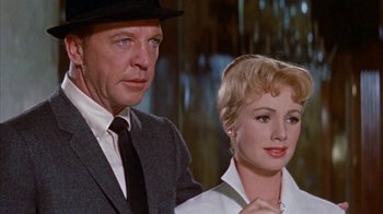 Movie still from “Pepe” (1960), directed by George Sidney – A man and a woman standing next to each other; Close Up shot, Low angle