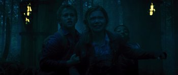Movie still from “Percy Jackson: Sea of Monsters” (2013), directed by Thor Freudenthal – A group of people standing next to each other in the woods; Medium shot, Low angle