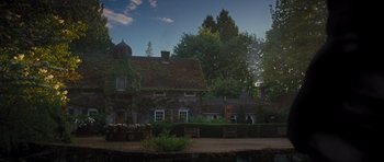 Movie still from “Percy Jackson: Sea of Monsters” (2013), directed by Thor Freudenthal – An old stone house with trees in the background; Extreme Wide shot, Low angle