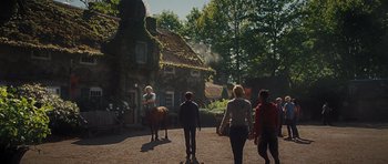 Movie still from “Percy Jackson: Sea of Monsters” (2013), directed by Thor Freudenthal – A group of people walking in front of a house; Wide shot, Low angle