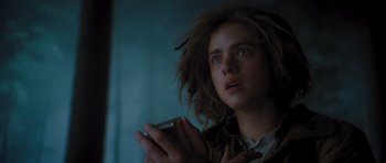 Movie still from “Percy Jackson: Sea of Monsters” (2013), directed by Thor Freudenthal – A woman with dreadlocks is holding a cell phone; Close Up shot, Low angle